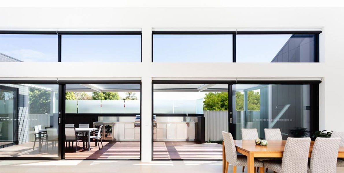 An indoor-outdoor entertaining zone with large windows showcasing home extensions and renovations in Melbourne.