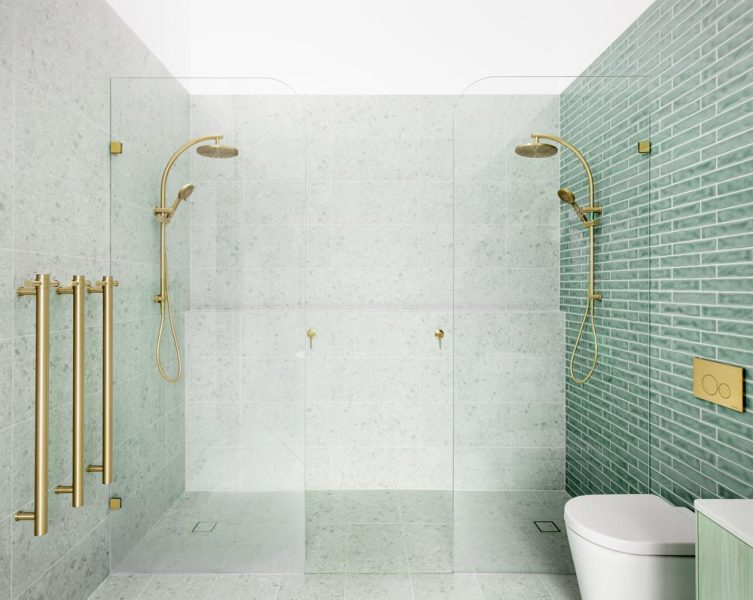 A luxurious twin-shower ensuite home renovation in Melbourne — showcasing sage-green tiles paired with terrazzo stone.