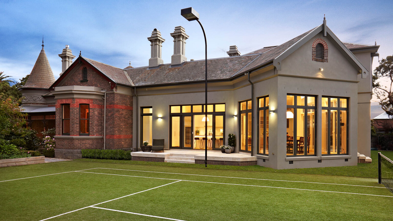 Hawthorn extension and renovations - diagonal view of tennis court and house