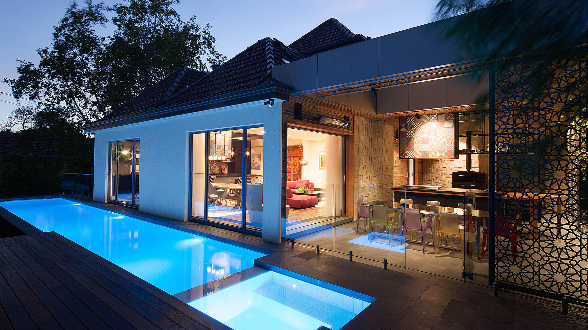 Malvern extensions and renovation - the diagonal view outside of the house from the pool, looking in