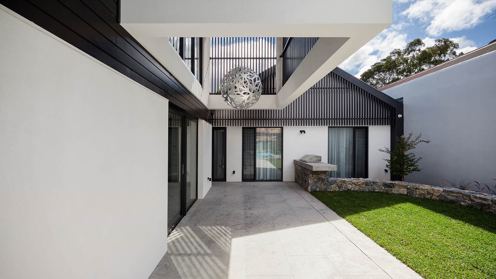 Port Melbourne Esplanade new build - outside barbeque area and grass lawn