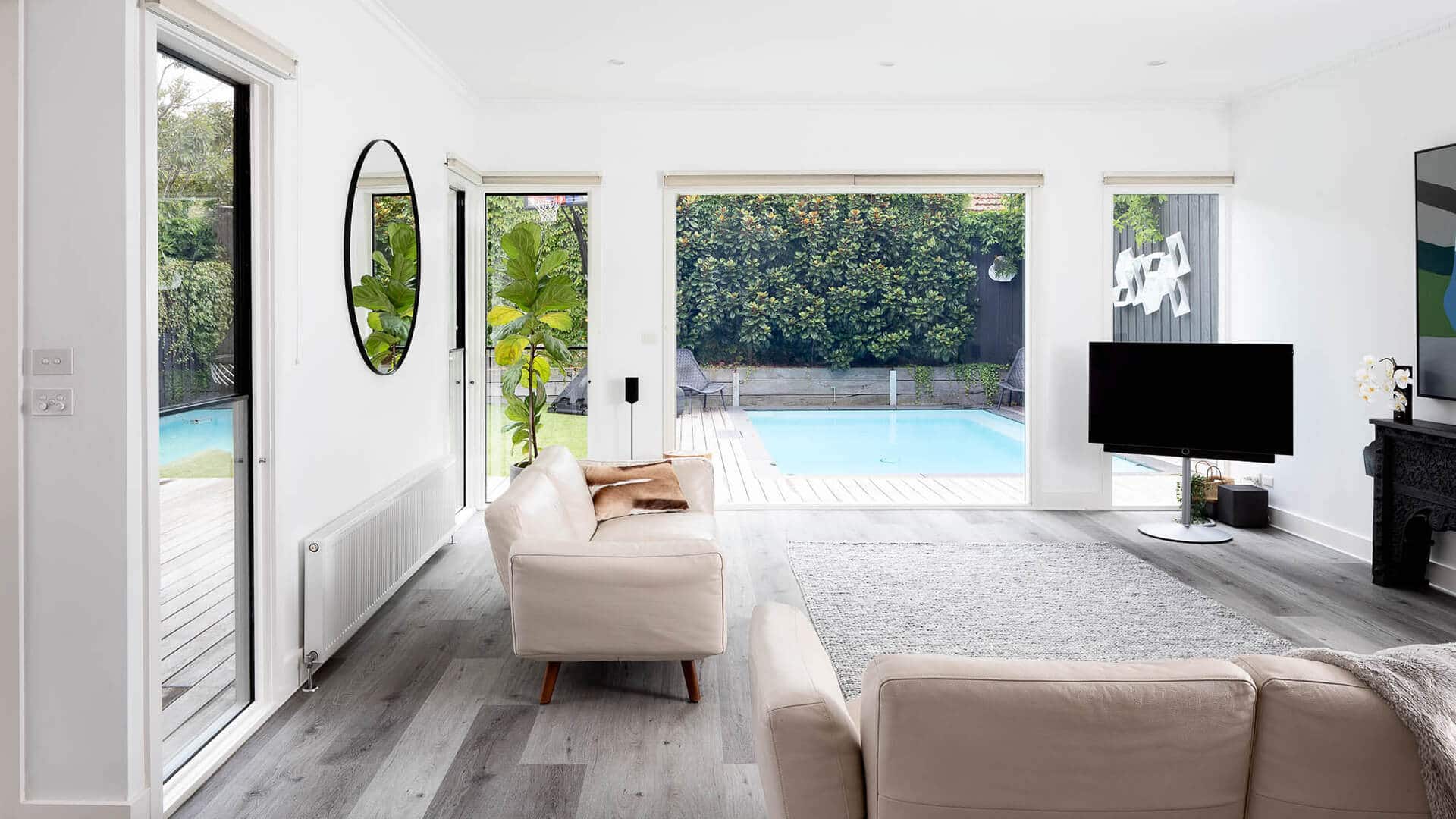 Kew second storey extension & ground floor alterations - view from inside lounge area looking towards pool